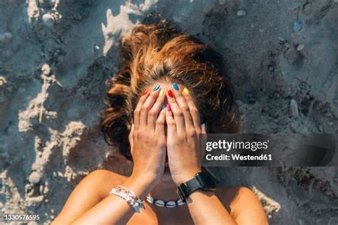 32,663 Female Sunbathing On Beach Stock Photos & High